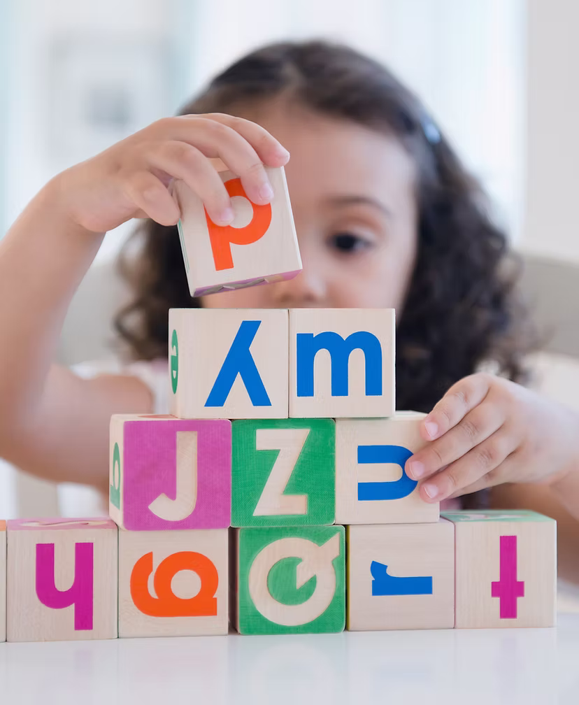 A child stacking blocks
